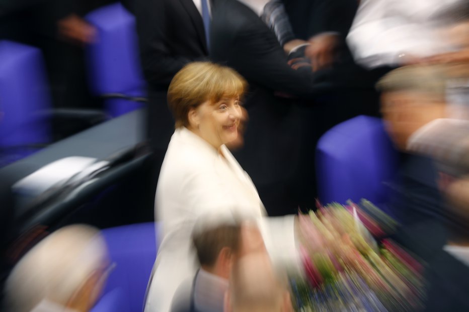 Fotografija: Angela Merkel po ponovni izvolitvi v parlamentu. FOTO: Kai Pfaffenbach, Reuters