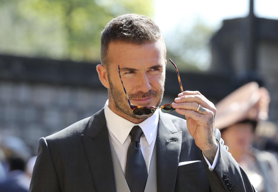 Fotografija: David Beckham je na poroko prispel v svojem slogu. FOTO: AP
