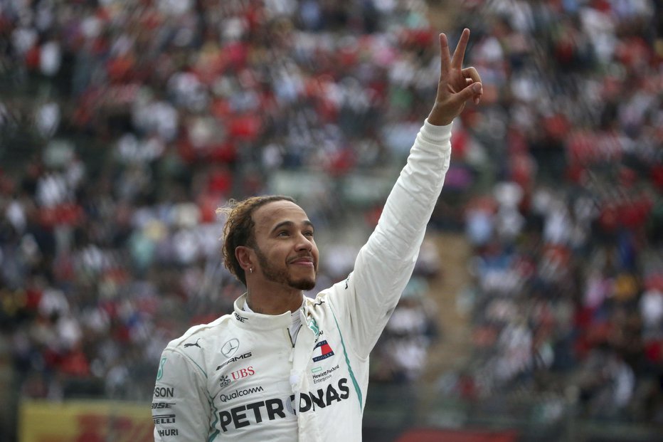 Fotografija: Hamilton je pridirkal do petega naslova svetovnega prvaka. FOTO: AP