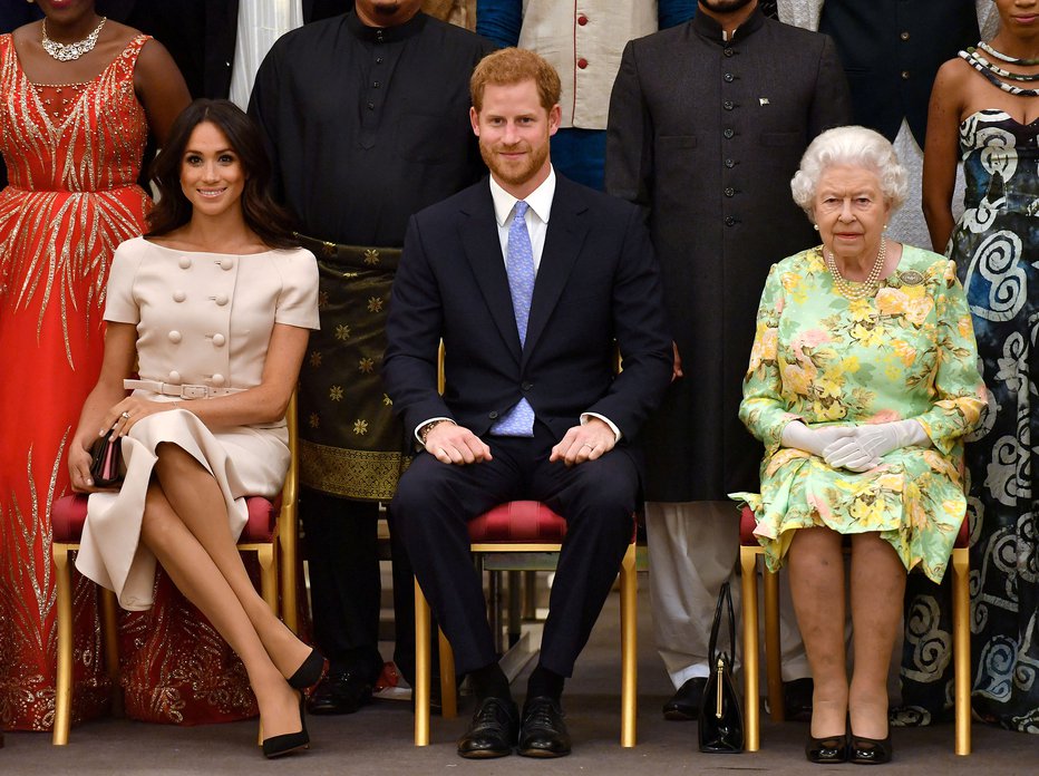 Fotografija: Kraljica Elizabeta II., princa Harry in Meghan Markle na sprejemu v Buckinghamski palači leta 2018. FOTO: John Stillwell/Pool via Reuters
