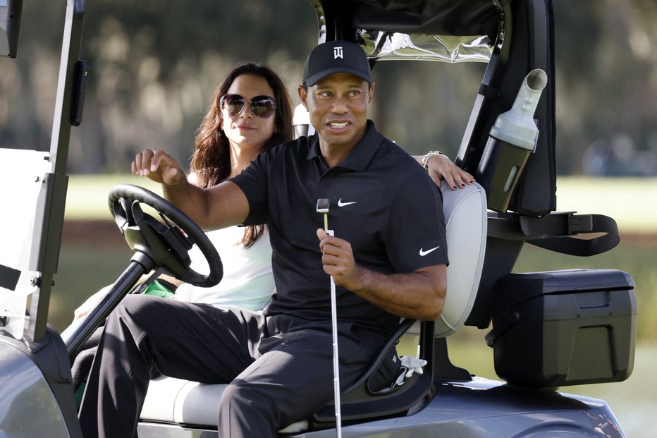 Fotografija: Tiger Woods in Erica Herman. FOTO: Joe Skipper, Reuters
