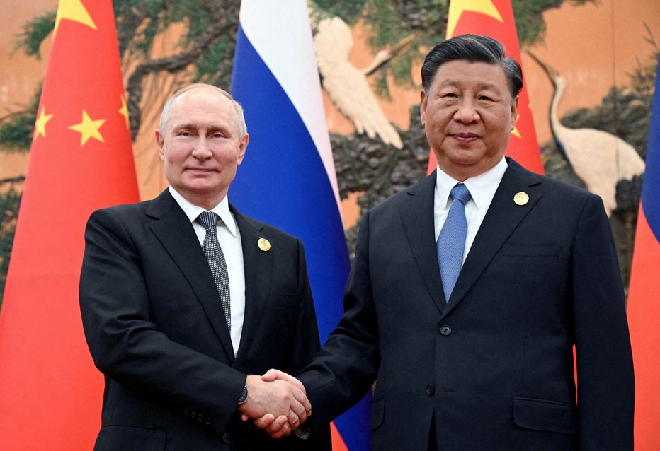 Fotografija: Vladimir Putin in Xi Jinping. FOTO: Sputnik Via Reuters