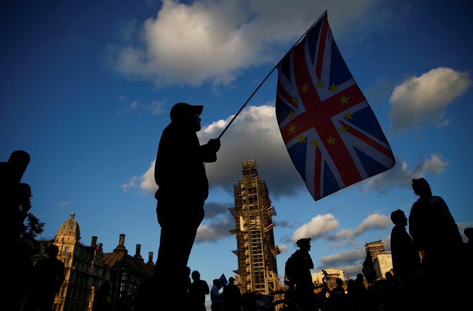 Fotografija: Britanski poslanci so potrdili zakon o izstopnem sporazumu z EU. FOTO: Henry Nicholls, Reuters