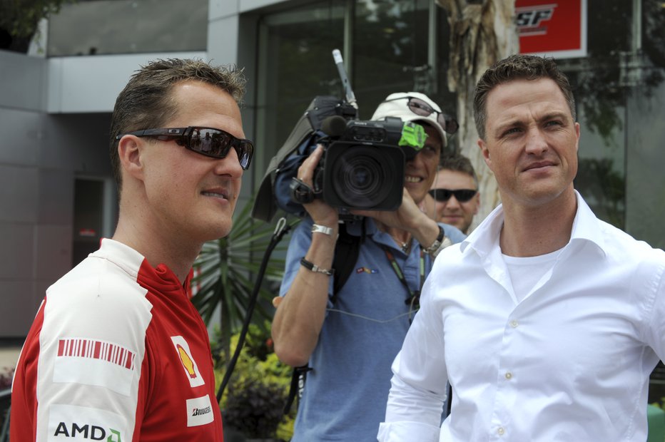 Fotografija: Michael Schumacher in Ralf Schumacher leta 2009 v Maleziji. FOTO: Action Images