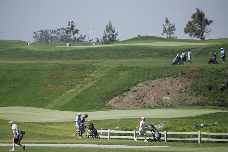 Fotografija: Na golf igrišču. FOTO: Mike Blake Reuters