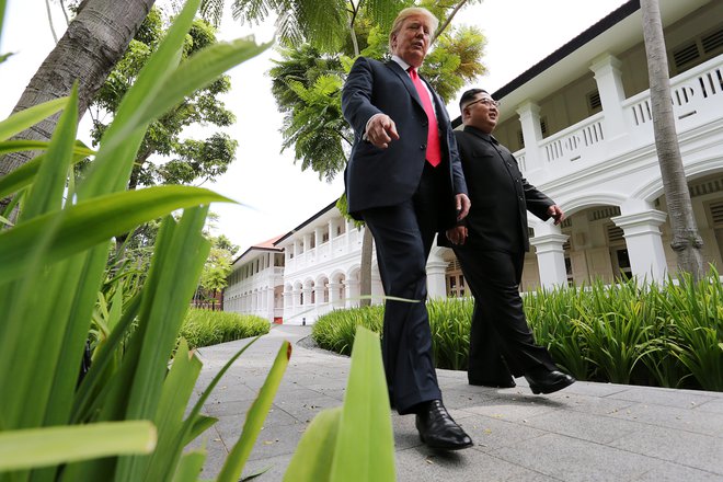 Donald Trump in Kim Džong Un. FOTO: Jonathan Ernst, Reuters