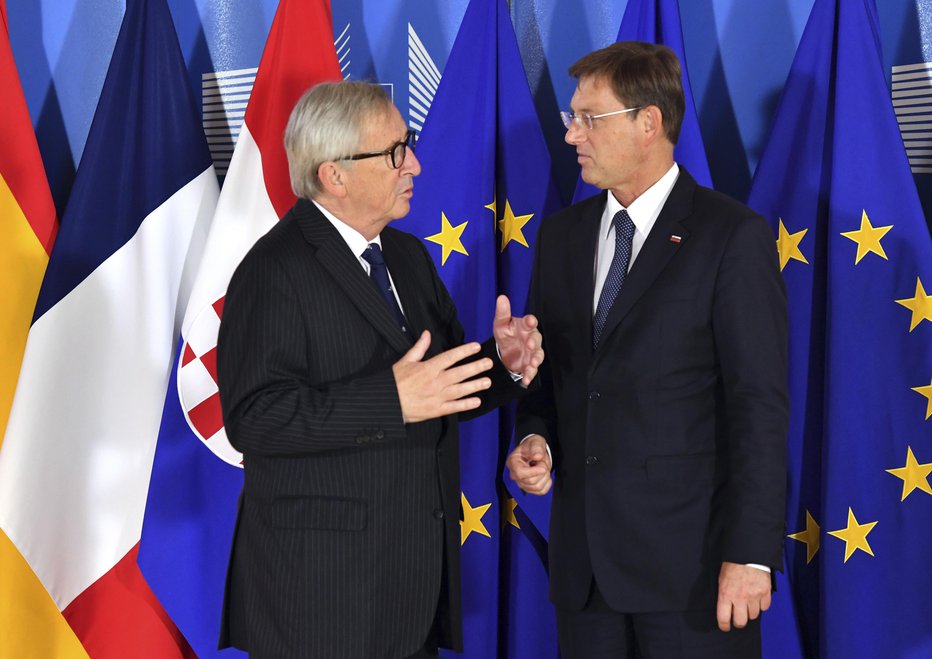 Fotografija: V Bruslju se je Miro Cerar srečal z Jean-Claudom Junckerjem. FOTO: AP