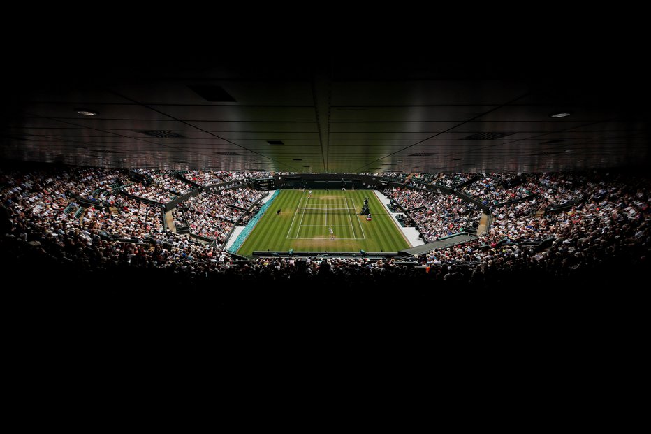 Fotografija: Finale Wimbledona se bo najbrž deloma prekrival s finalom nogometnega svetovnega prvenstva. FOTO: Reuters