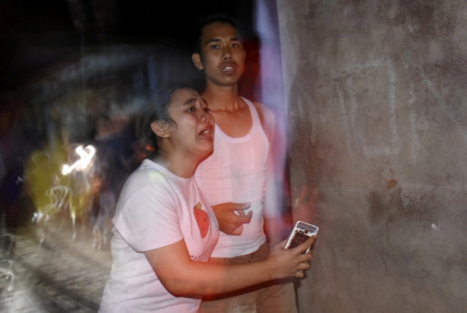 Fotografija: Ljudje v paniki. FOTO: Reuters