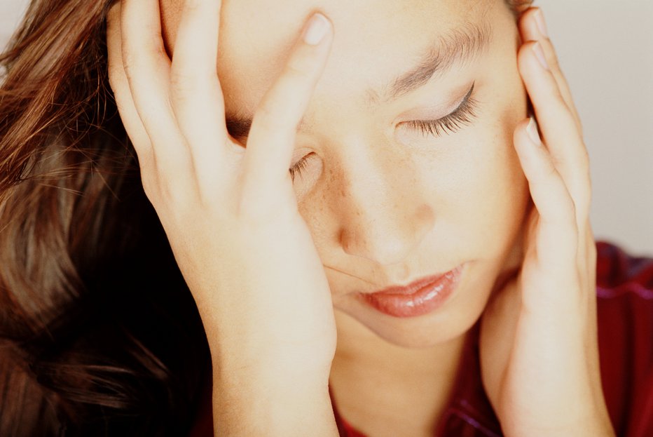 Fotografija: Glavobol je nadležna, a pogosta bolečina. (foto: thinkstock) FOTO: David De Lossy Getty Images