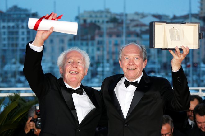 Belgijska bratska dvojica Jean-Pierre in Luc Dardenne sta z letošnjega festivala odšla z nagrado za naj režijo. FOTO: Reuters