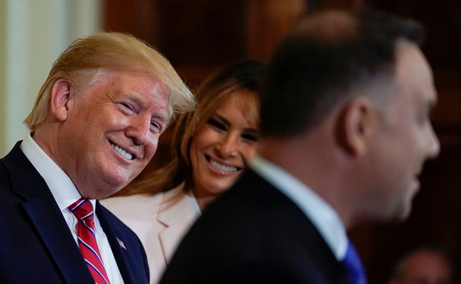 Fotografija: U.S. President Donald Trump and first lady Melania Trump react to remarks from Poland's President Andrzej Duda during a Polish-American reception in the East Room of the White House in Washington, U.S., June 12, 2019. REUTERS/Kevin Lamarque - RC11B12B2890 FOTO: Kevin Lamarque Reuters