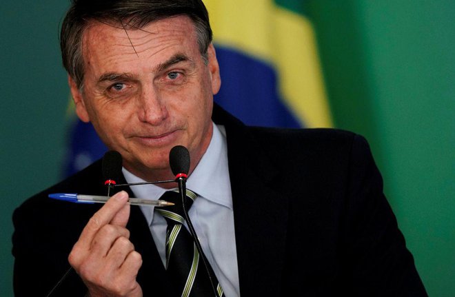 Brazilski predsednik se je spravil nad nevladne organizacije in hollywoodskega zvezdnika. FOTO: reuters