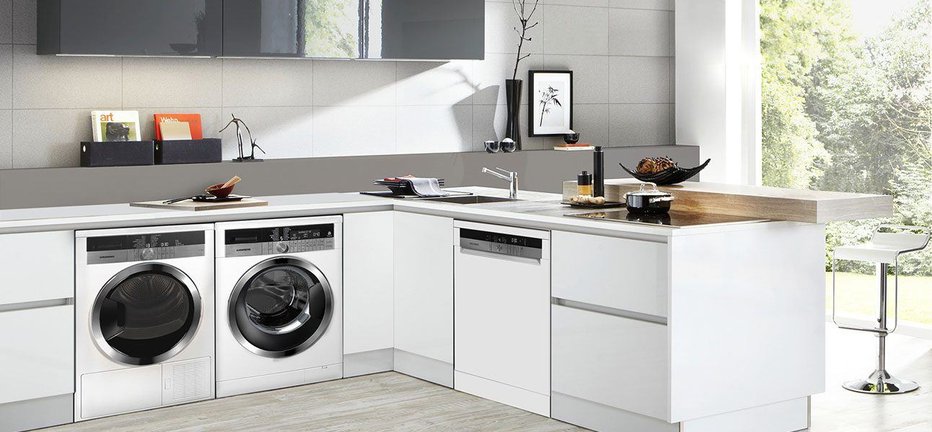 Fotografija: Angleži in nekateri drugi postavijo pralni in sušilni stroj v kuhinjo. FOTO: Guliver/Getty Images