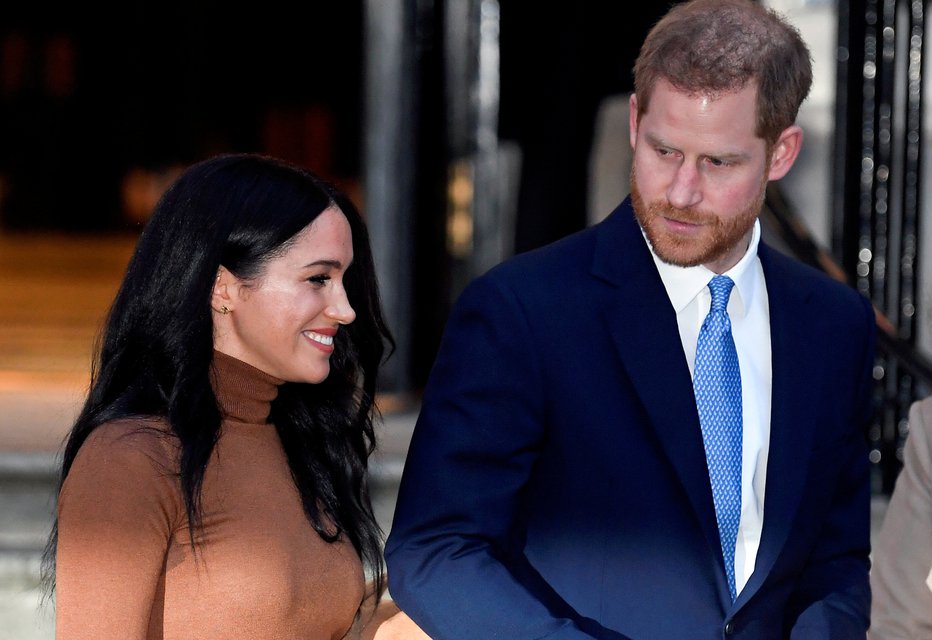 Fotografija: Princ Harry in njegova žena Meghan. FOTO: Toby Melville, Reuters