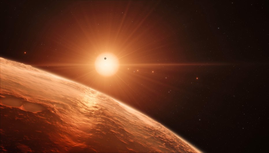Fotografija: This handout artist’s impression released by the European Southern Observatory on February 22, 2017 shows the view just above the surface of one of the planets in the TRAPPIST-1 system.
The stunning discovery of seven Earth-like planets orbiting a small star in our galaxy opens up the most promising hunting ground to date for life beyond the Solar System, researchers said Wednesday. All seven are within 20 percent of the size and mass of our own planet and almost certainly rocky, and three are ideally situated to harbour life-nurturing oceans of water, they reported in the journal Nature.
/ AFP PHOTO / European Southern Observatory / M. Kornmesser / RESTRICTED TO EDITORIAL USE - MANDATORY CREDIT 