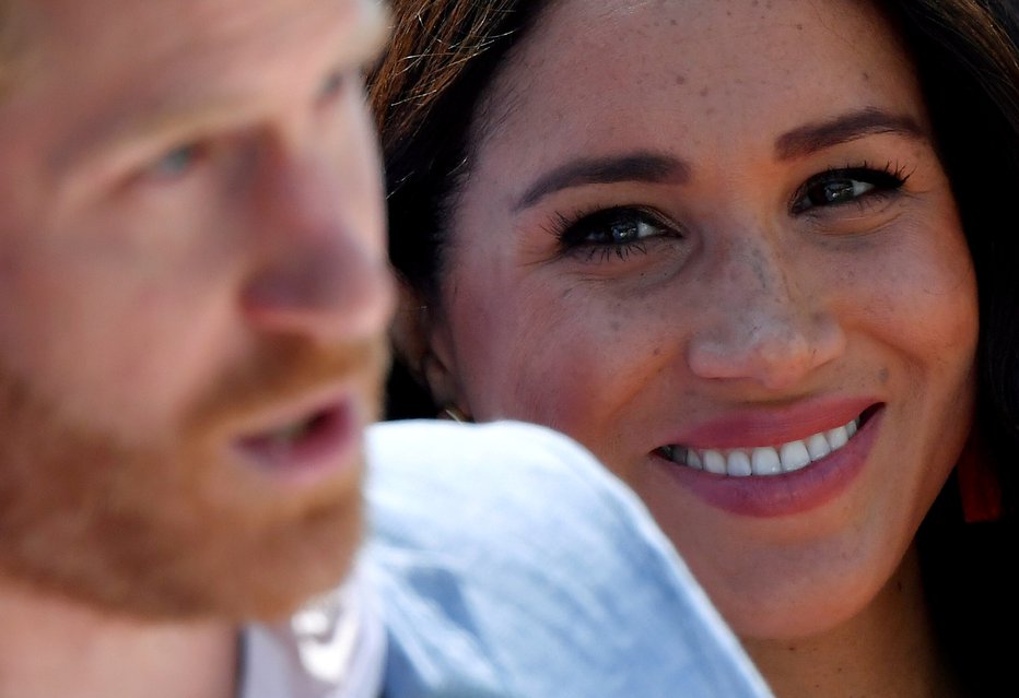 Fotografija: Princ Harry in njegova žena Meghan. FOTO: Toby Melville, Reuters
