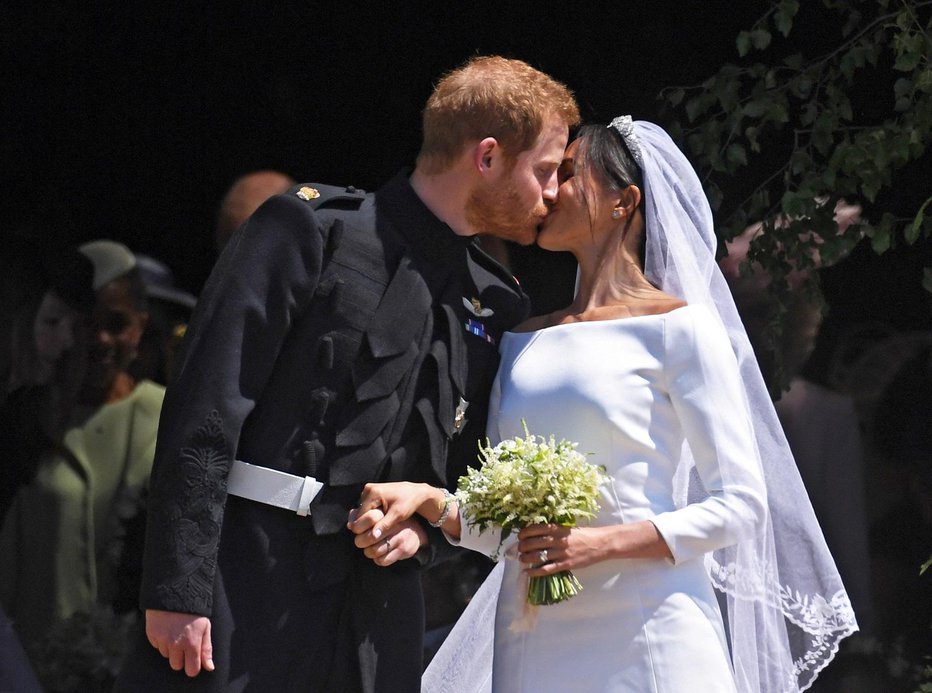 Fotografija: Princ Harry in Meghan Markle sta se za javnost poročila 19. maja 2018, v intimnem obredu pa že tri dni prej. FOTO: Reuters Reuters