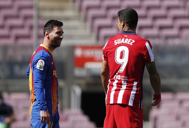 Lionel Messi in Luis Suarez sta bila nekoč pri Barceloni soigralca. FOTO: Albert Gea/Reuters