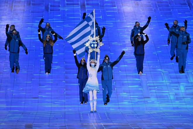 Kot prva se je tradicionalno predstavila skromna delegacija iz Grčije, zibelke olimpijskih iger. FOTO: Manan Vatsyayana/AFP
