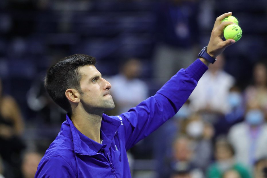 Fotografija: Novak Đoković lahko v nedeljo osvoji rekordni 21. turnir za grand slam. FOTO: Kena Betancur/AFP