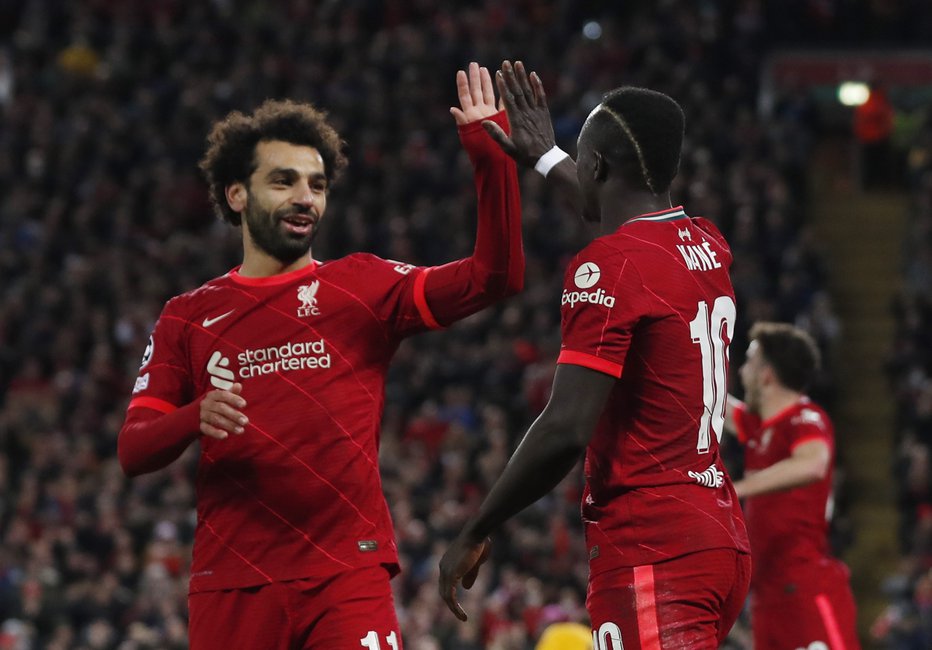 Fotografija: Liverpool je suvereno opravil z Atleticom, tako sta se zmage veselila Mohamed Salah in Sadio Mane. FOTO: Lee Smith/Reuters
