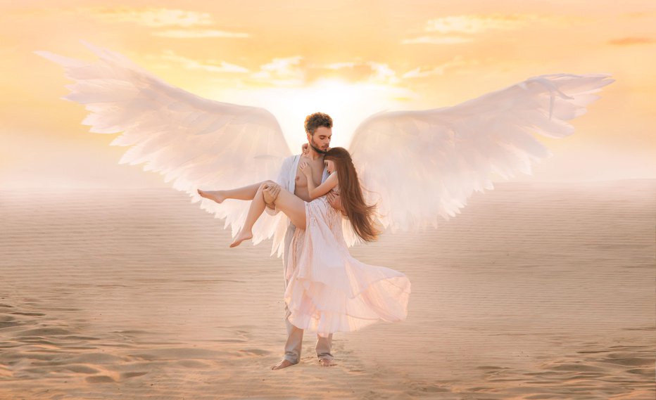 Fotografija: Strong male costume angel holds hug fragile innocent woman in arms. concept protection prayer security helper keeper love faith help religion. art sunset sky in desert. Girl and handsome man embracing