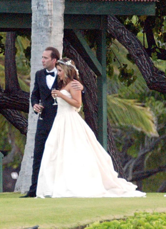 Excl.  310 246 0902
Lisa Marie Presley and Nicolas Cage get married 08/10/02 in Hawaii at the Mauna Lani Bay hotel on the Big Island. The ceremony took place on the lawn in front of the Eva Parker Woods Cottage a historic building. The wedding was attened by Lisa Marie's mother Priscilla Presley and Nicolas's son from a previous marraige among others.,Image: 16083842, License: Rights-managed, Restrictions: , Model Release: no, Credit line: Profimedia