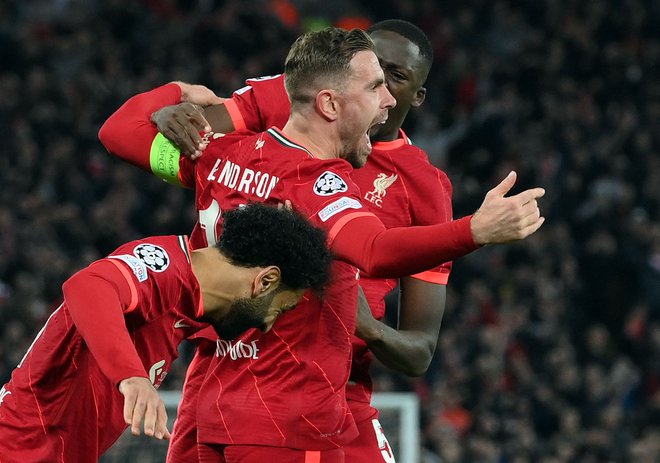 Jordan Henderson se je veselil uvodnega zadetka Liverpoola. FOTO: Lluis Gene/AFP
