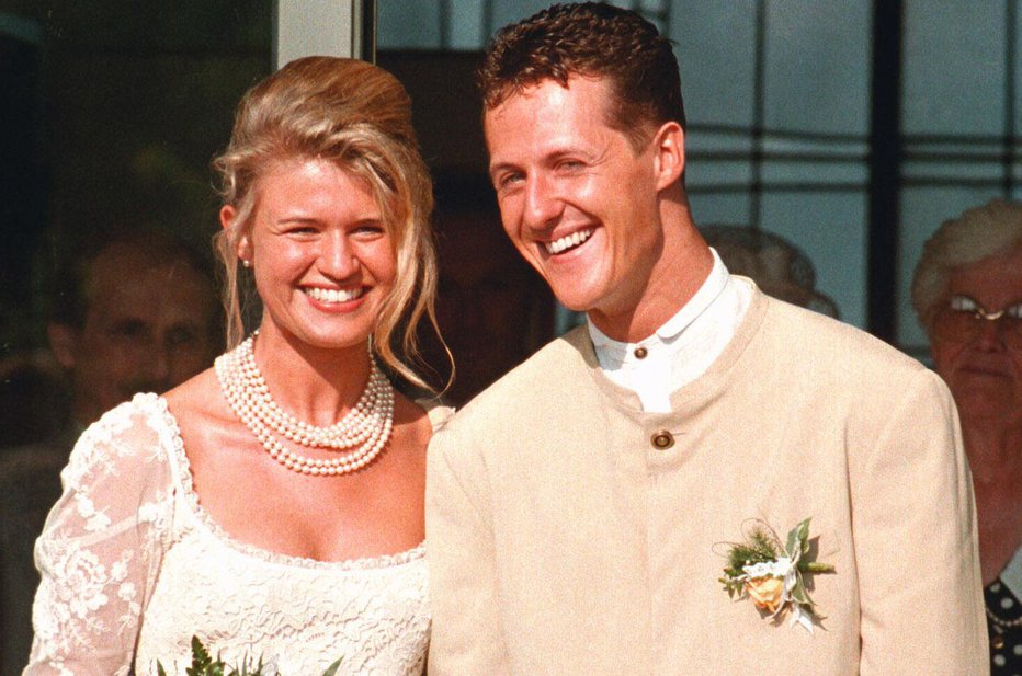 Fotografija: Michael in Corinna Schumacher na poročni dan 1. avgusta 1995. FOTO: Herbert Spies, Reuters
