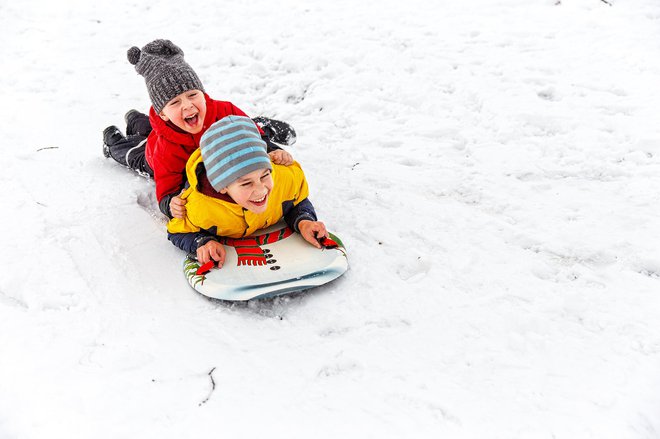 Otroci se bodo lahko naužili snežnih radosti. FOTO: Evgeniiand/ Getty Images

