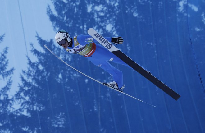 Peter Prevc je prispeval pomemben delež k novi ekipni lovoriki slovenskih skakalcev. FOTO: Leonhard Foeger/Reuters