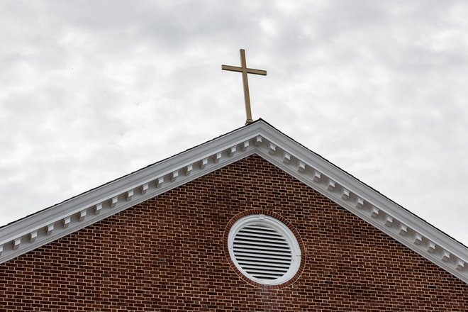 Težak križ nosi katoliška duhovščina zaradi spolnih zlorab. FOTO: Rosem Morton/Reuters
