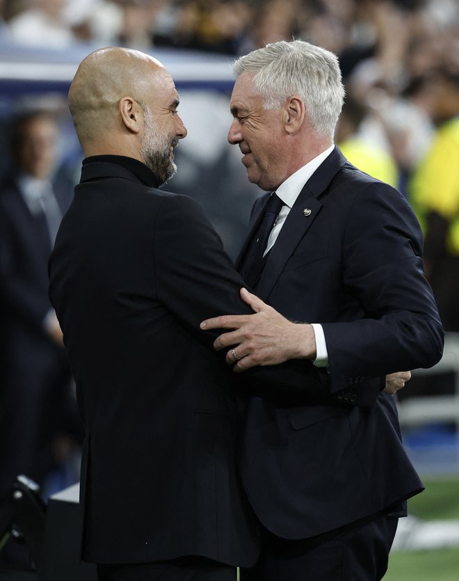 Pep Guardiola in Carlo Ancelotti sodita med najboljše nogometne trenerje na svetu. FOTO: Juan Medina/Reuters